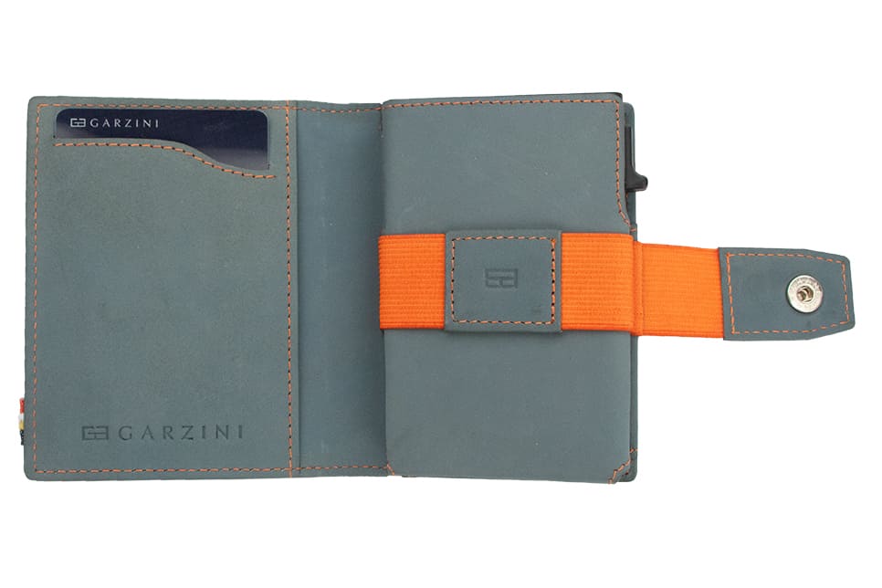 Open Garzini Metal Wallet in blue leather with orange strap, displaying card and cash slots