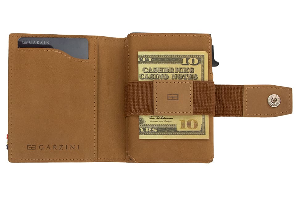 Open Garzini Metal Wallet in camel brown leather, holding a stack of cash
