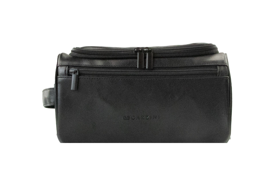 Close-up of Black Garzini Toiletry Bag front side, highlighting premium vegan leather and black zipper.