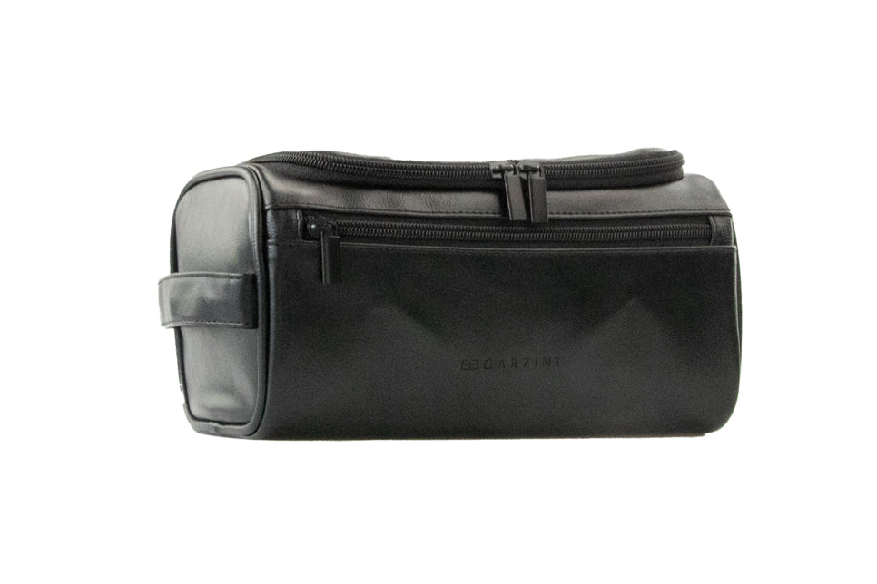 Black Garzini Toiletry Bag angled front side view, showing premium craftsmanship and convenient zipper placement.