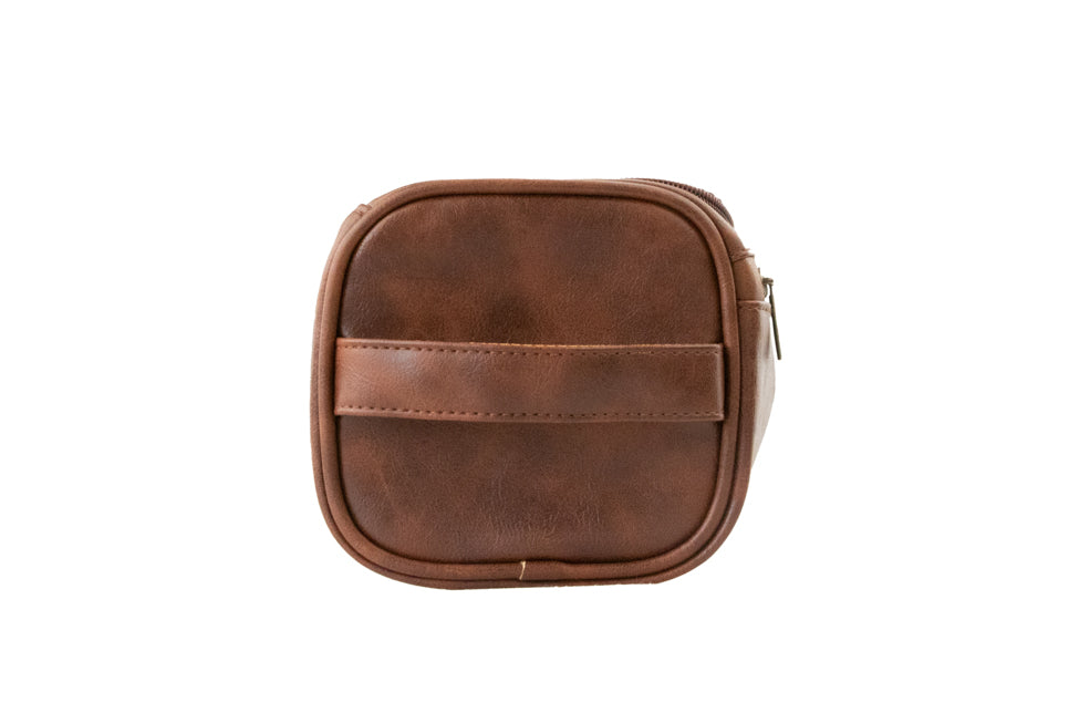 Brown Garzini Toiletry Bag side view, highlighting sleek design and travel-friendly features for frequent travelers.