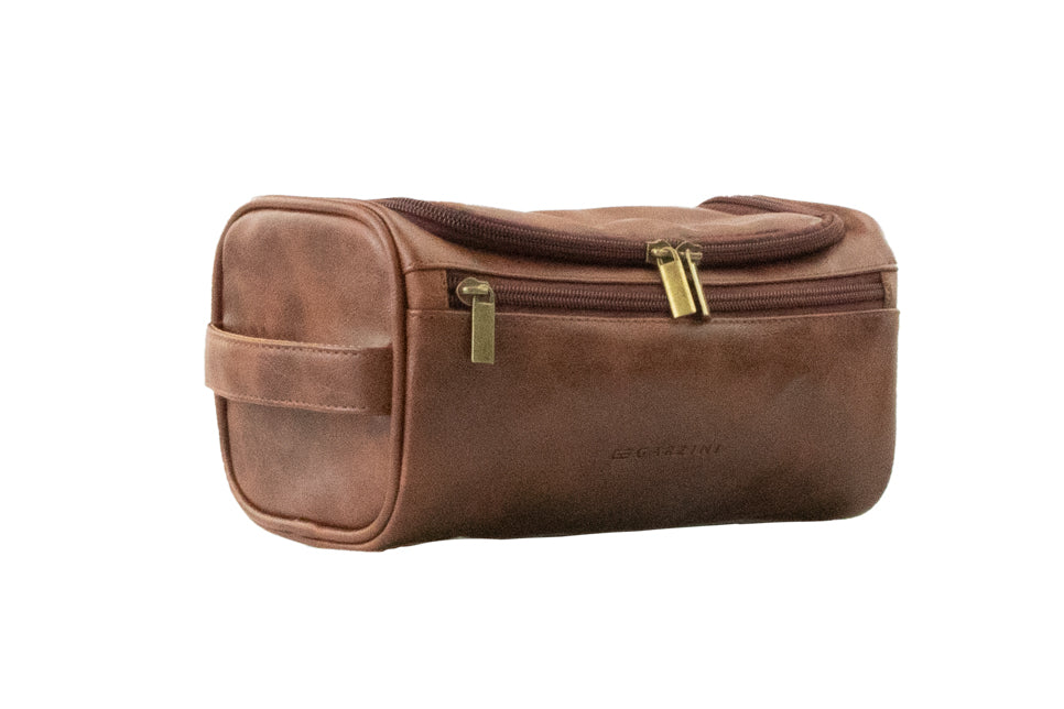 Brown Garzini Toiletry Bag angled front side view, combining classic style and convenient zipper design for travel essentials.