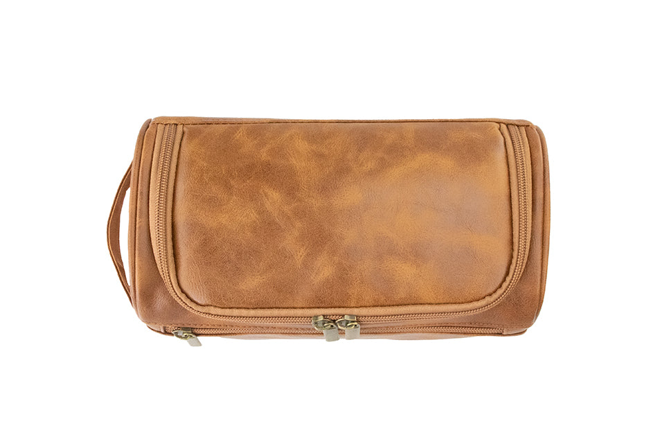 Overhead view of Cognac Garzini Toiletry Bag, showing multiple compartments for organized travel packing.